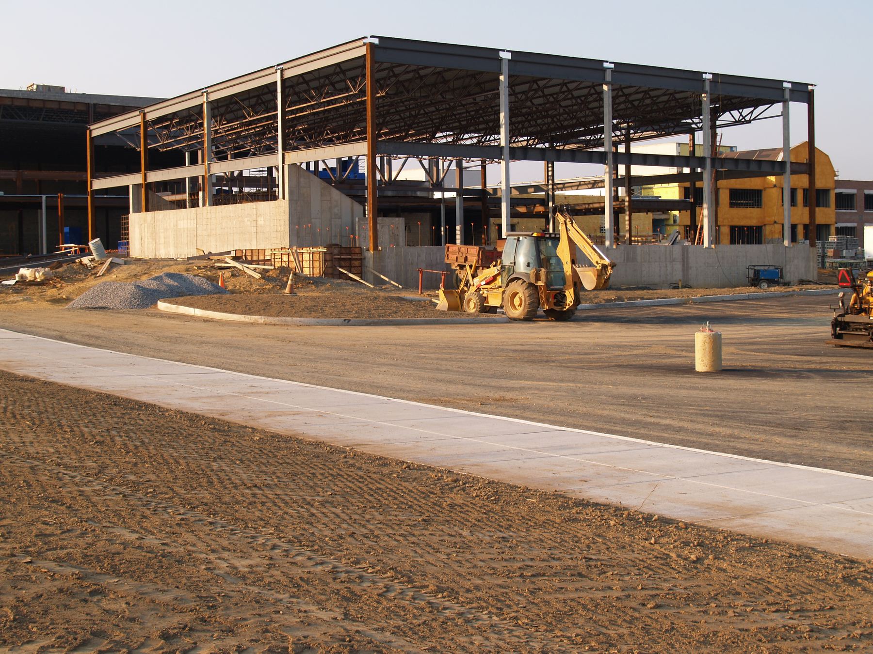 Steel-frame commercial building under construction on a development site