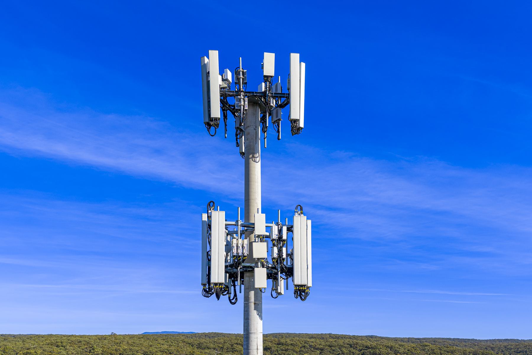 Cell tower against a clear blue sky