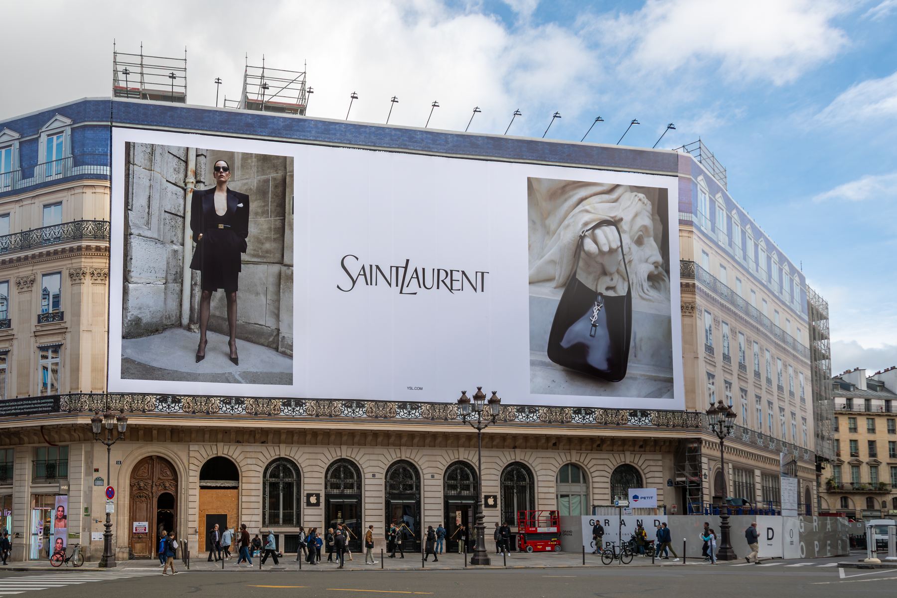 Large building-wrap billboard advertisement in a city center